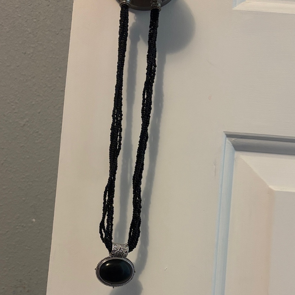 Black Beaded Necklace with Silver Pendant